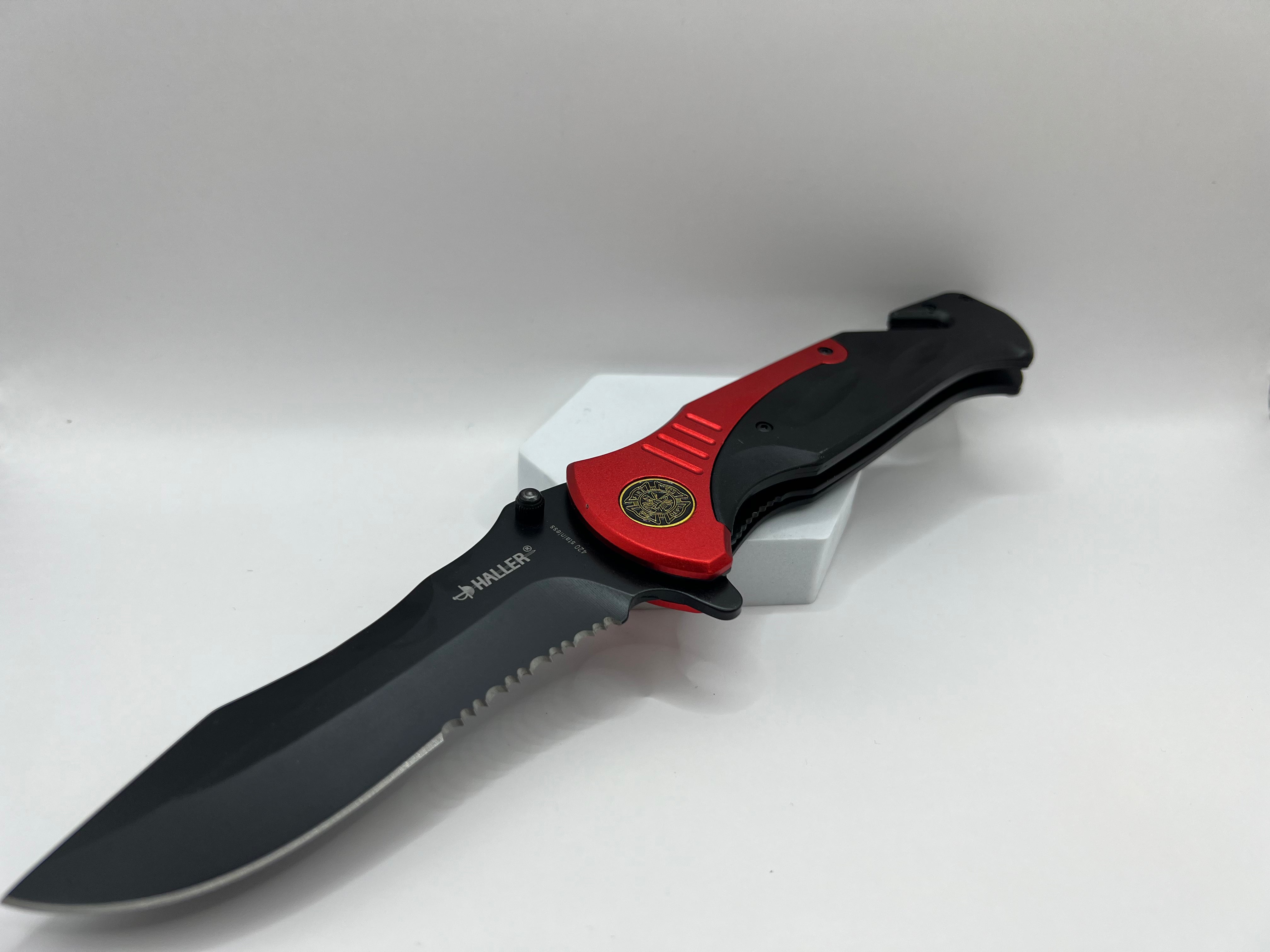 Versatile black coated pocket knife with partial wave cut