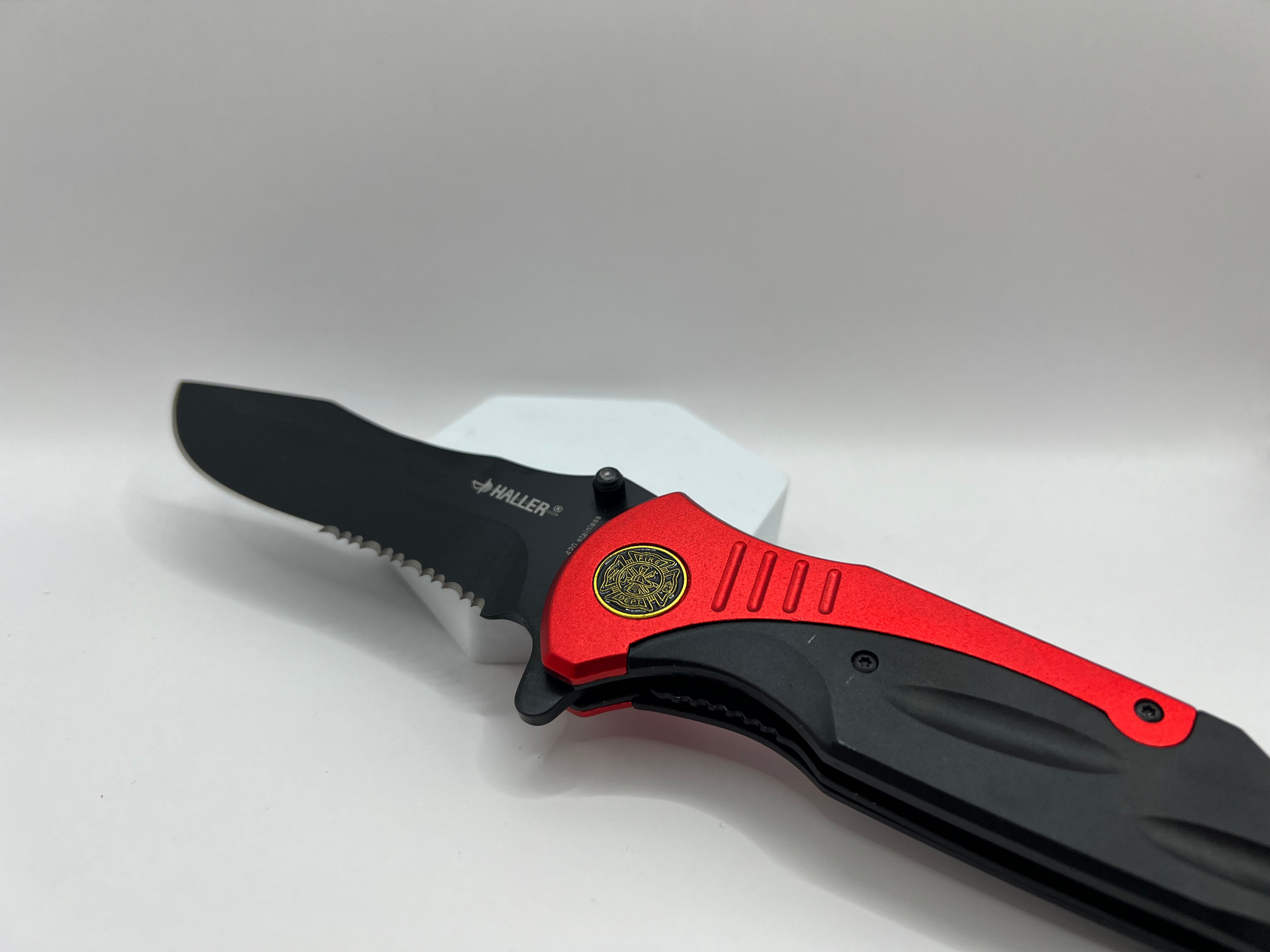 Versatile black coated pocket knife with partial wave cut