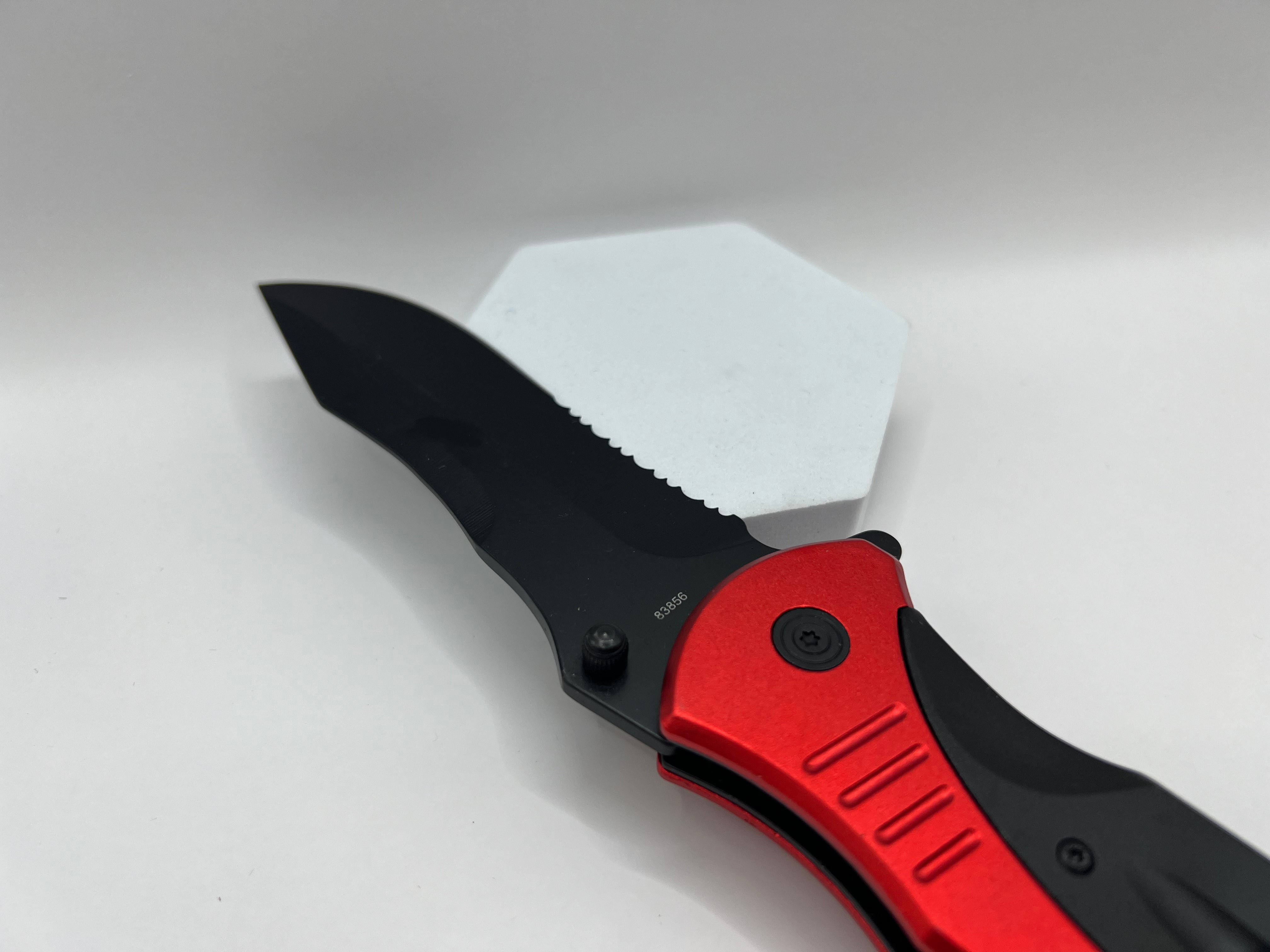 Versatile black coated pocket knife with partial wave cut