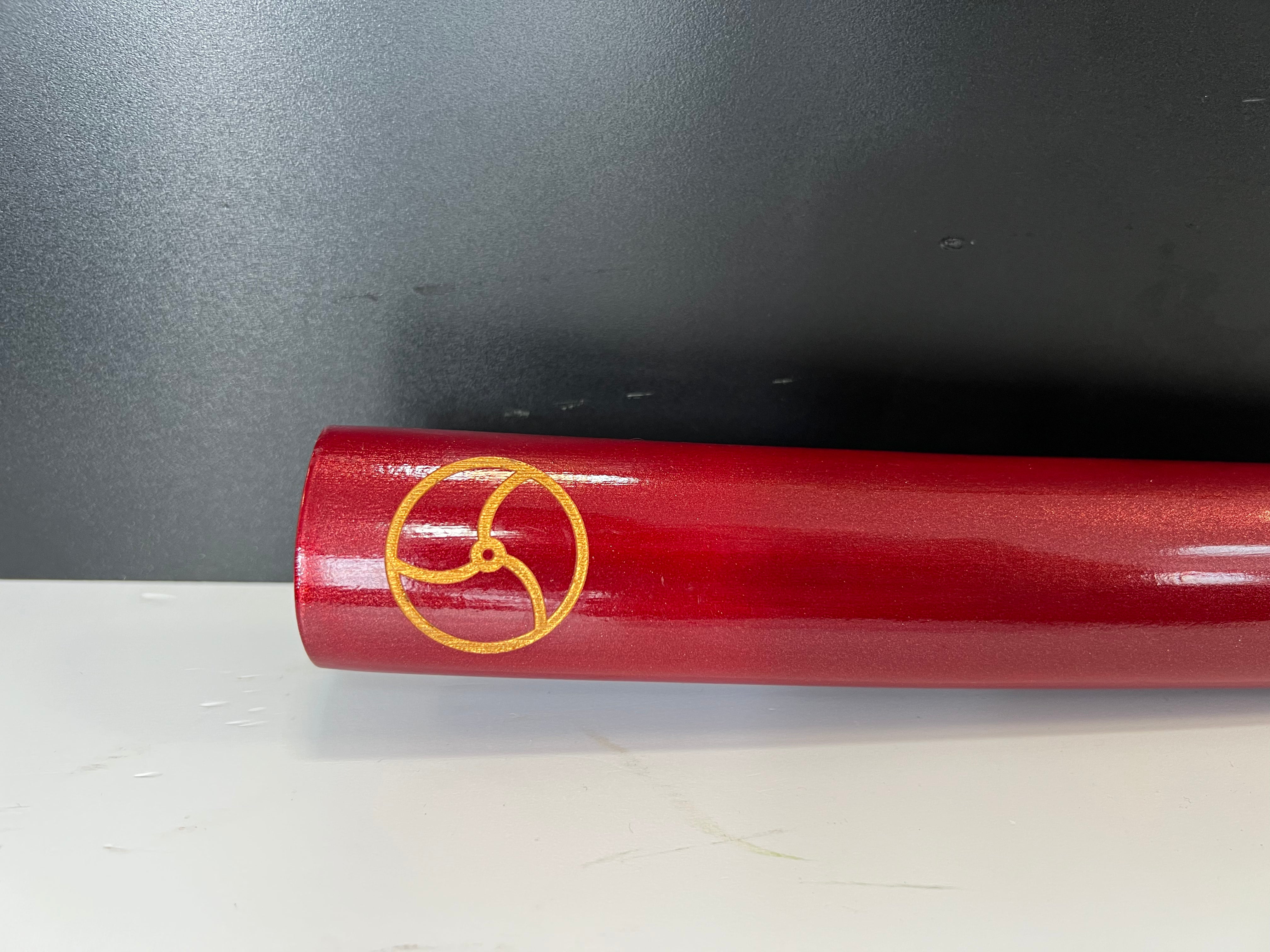 Katana in red with the seal of heaven (tomoe)